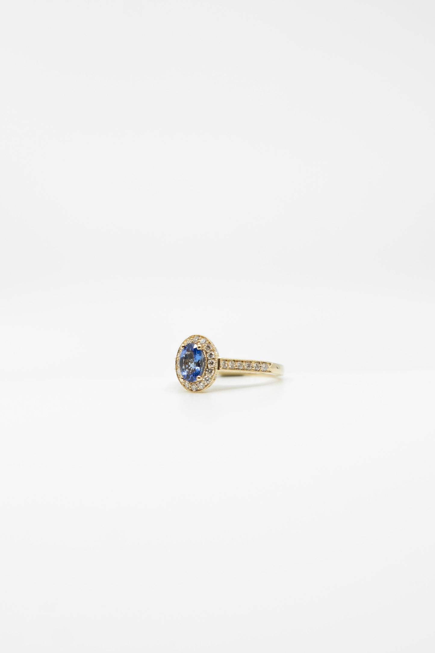 Classic Tanzanite & Diamond Halo Ring