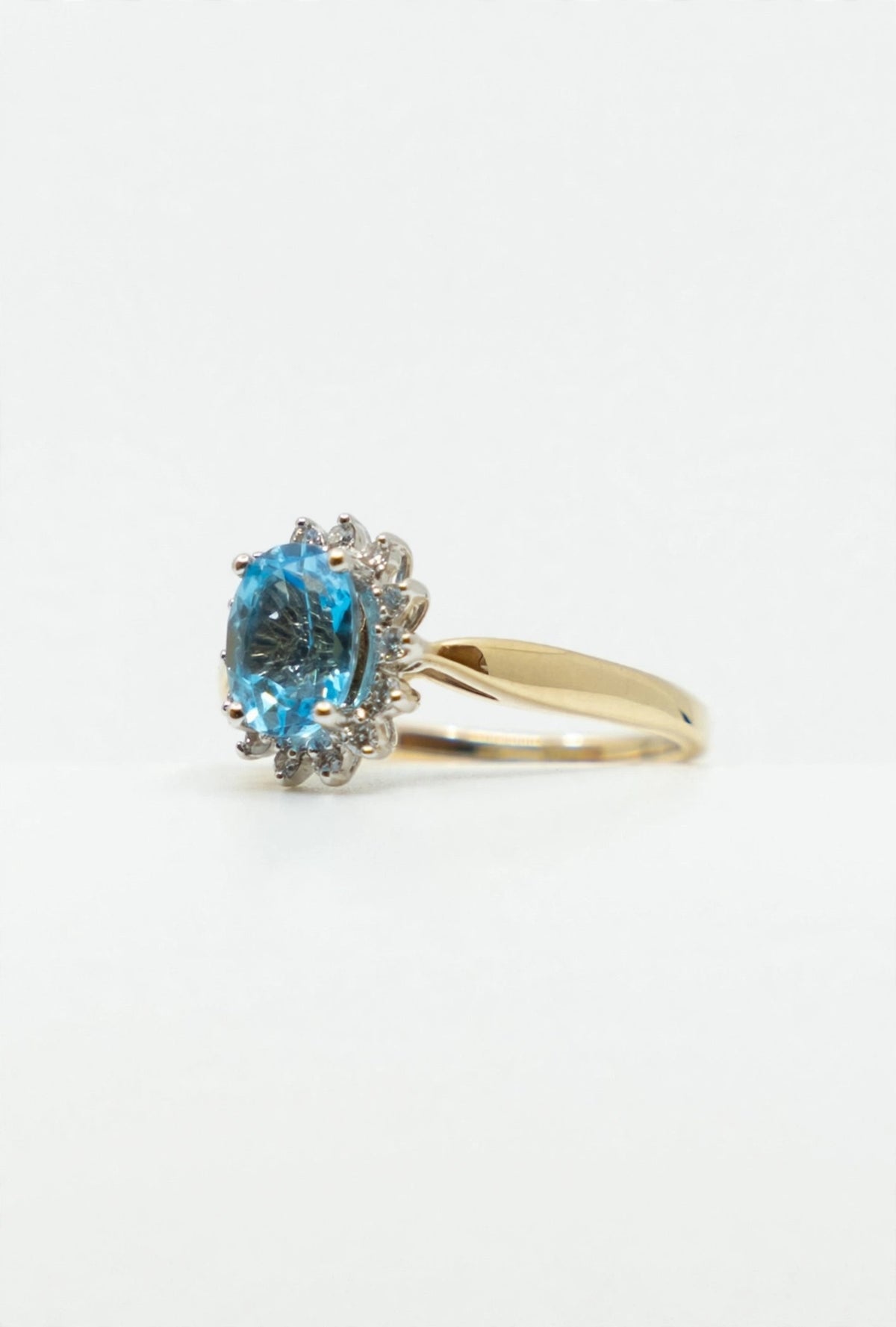 Halo Style Blue Topaz & Diamond Ring